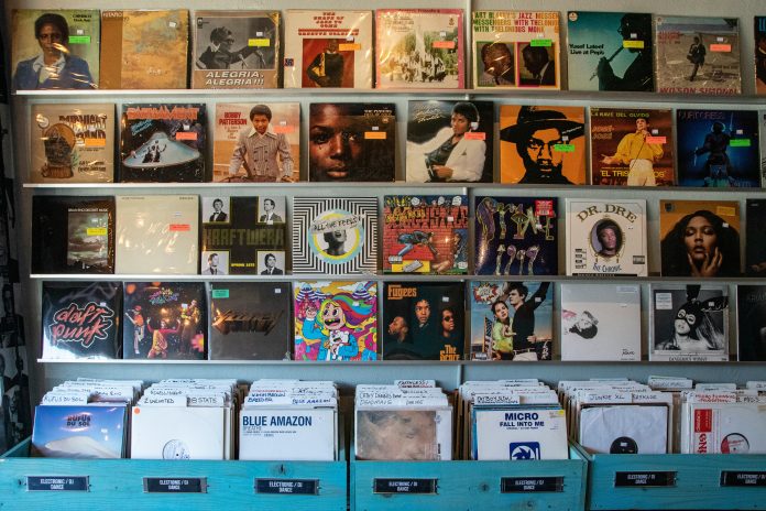 Multiple vinyl records organized in rows