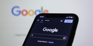 Google’s march towards AI Search risks further monopolizing content control and cuts out small creators Image of a smartphone at the Google search homepage
