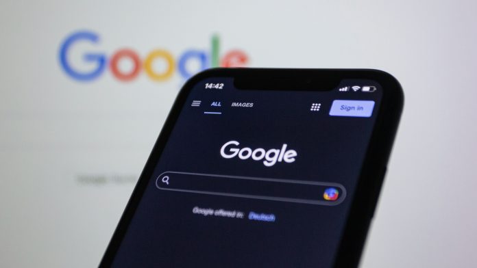 Image of a smartphone at the Google search homepage
