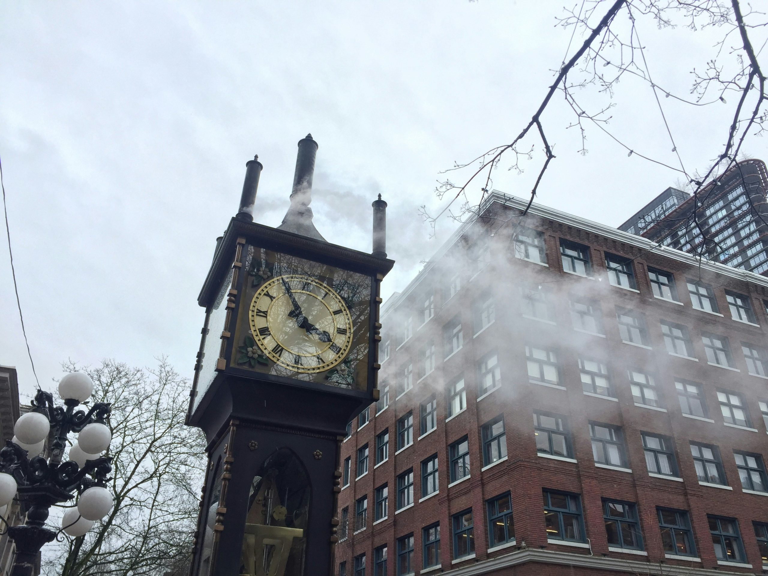 a photo of the Gastown Steam Clock, with steam released from it.
