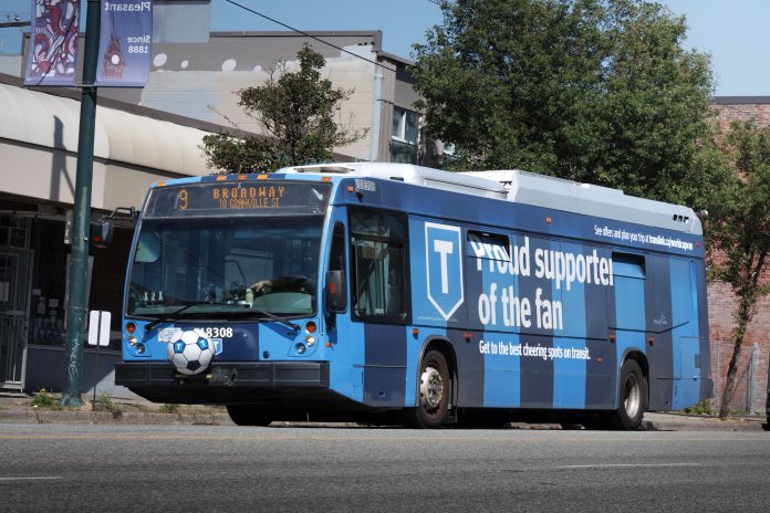 Photo of a bus wrapped in the FIFA World Cup with a soccer ball on the front