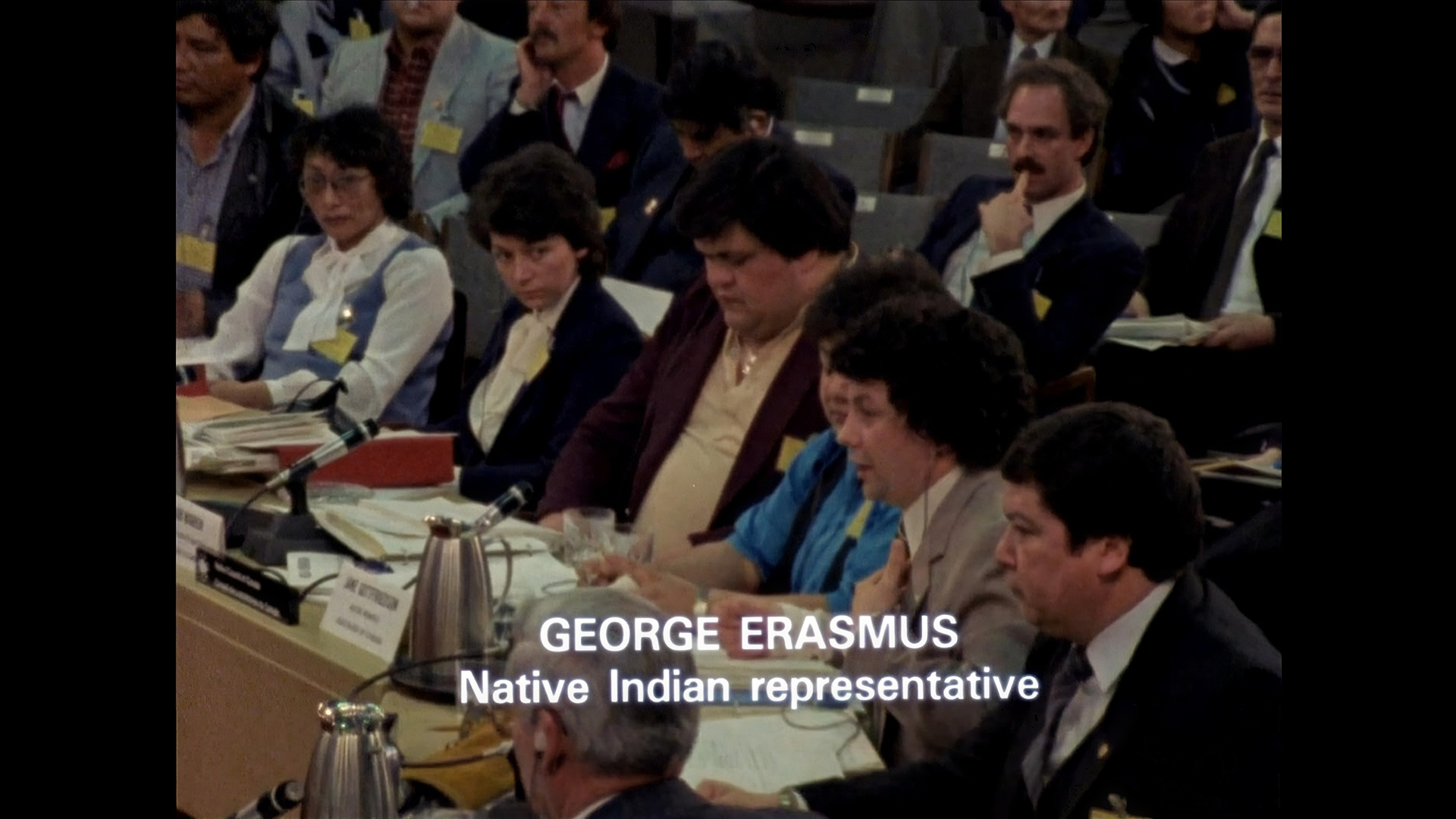 A photo of an Indigenous representative at the First Ministers’ Conferences on Indigenous Constitutional Matters, a still from the documentary