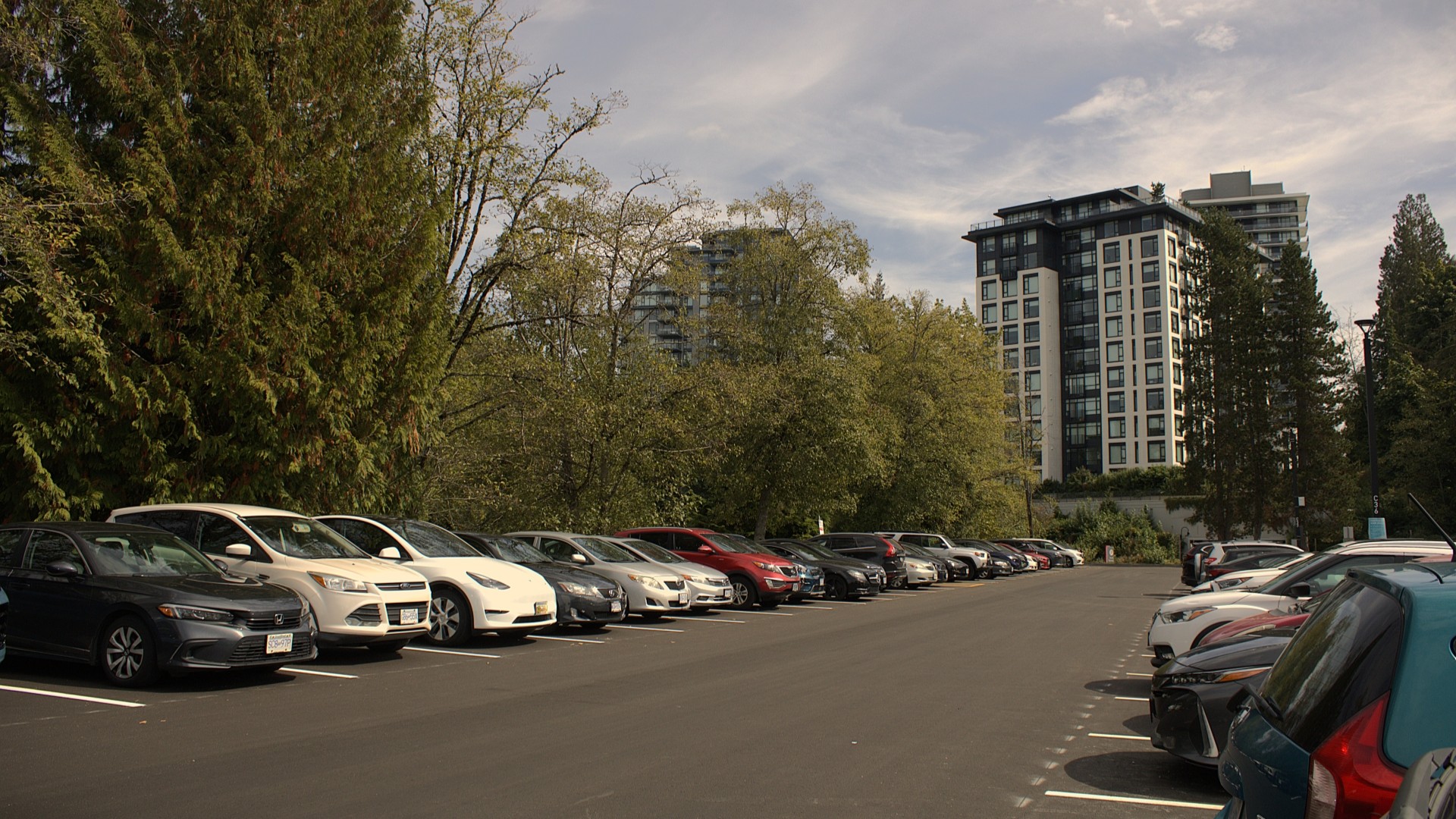 An SFU parking lot with cars in every stall